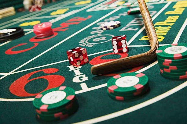 Mobile phone displaying login kingdomtoto Boom City live table interface with dealer and game controls